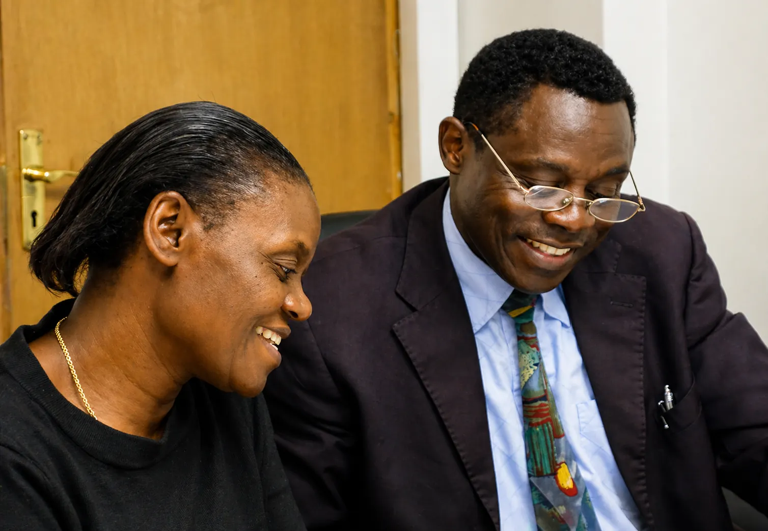 Two early ICCF leaders seated together in conversation.